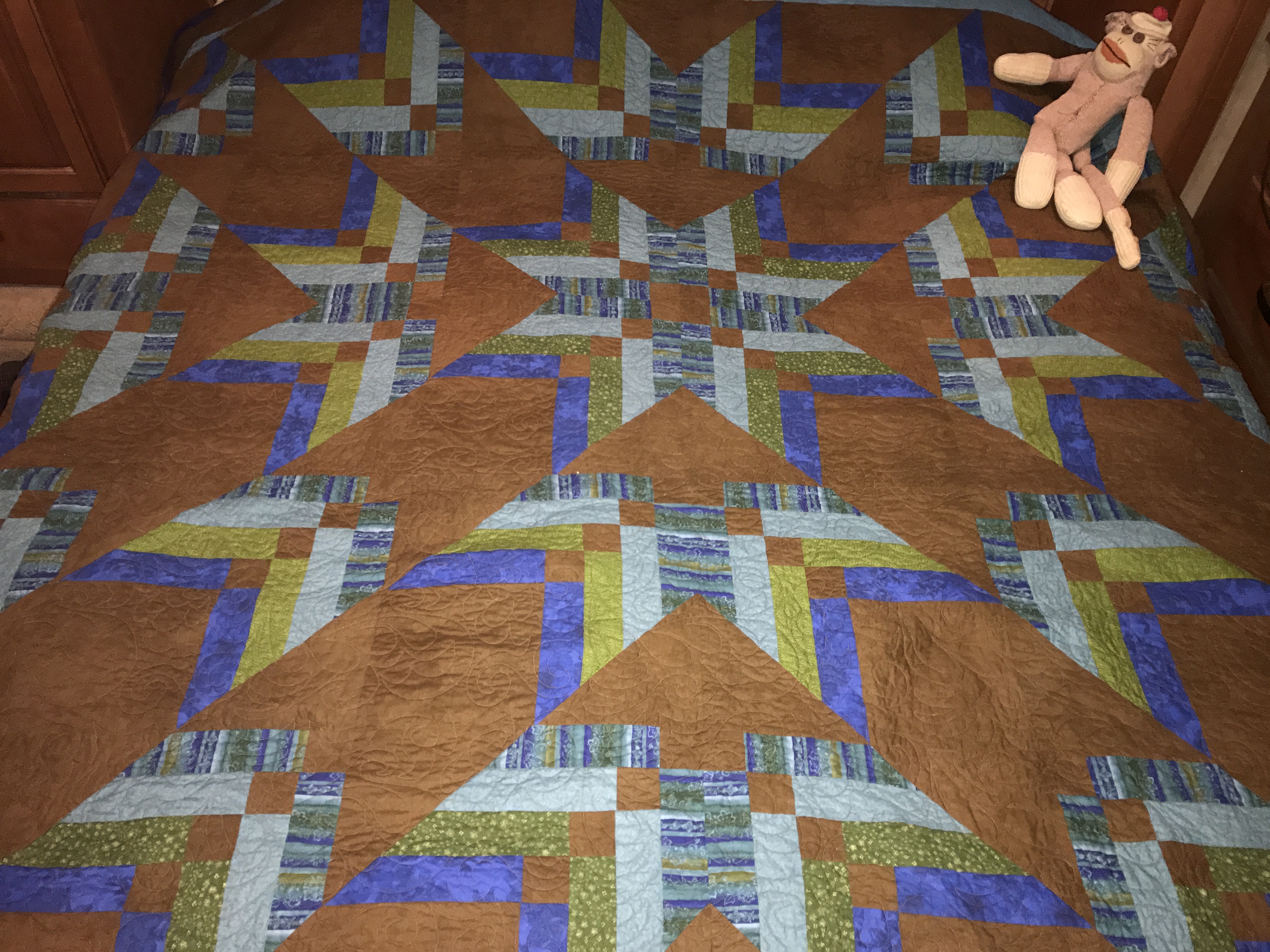 Quilt with sock monkey.JPG