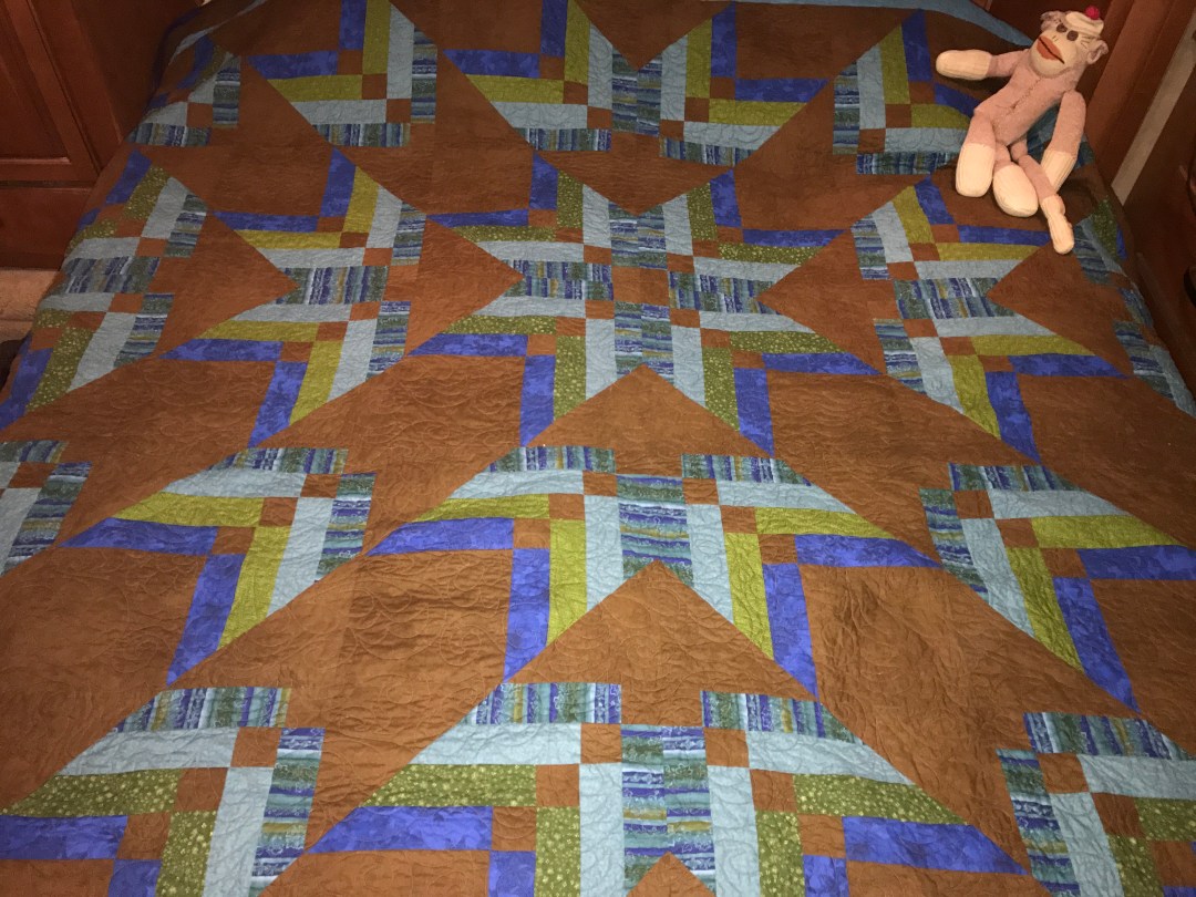 Quilt with sock monkey.JPG