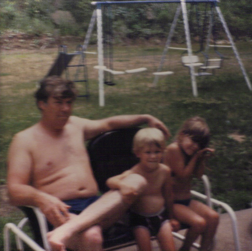 Dad with the kids out back in Boaz 1983