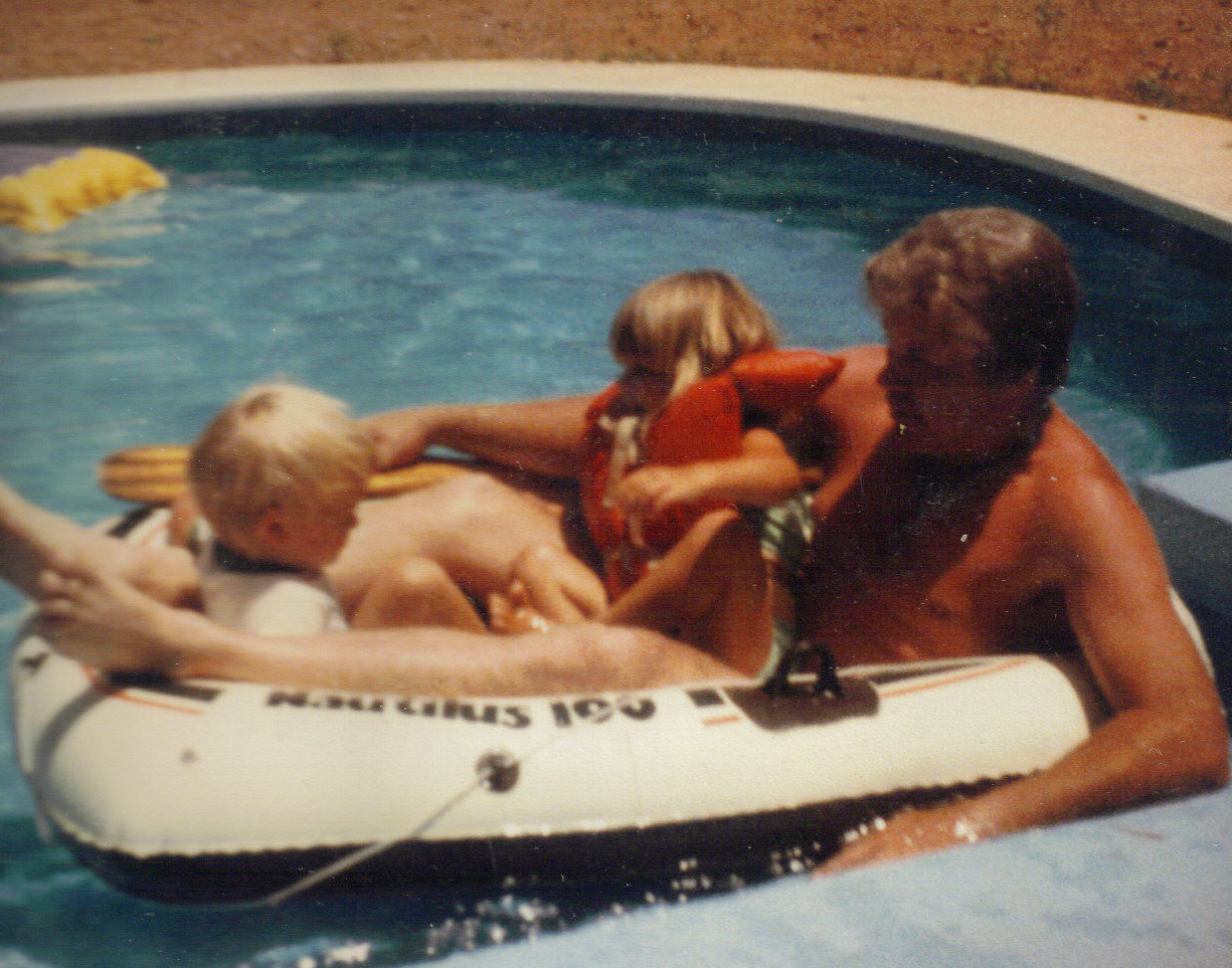 Dad in boat in the pool with Marie and Matt 1983