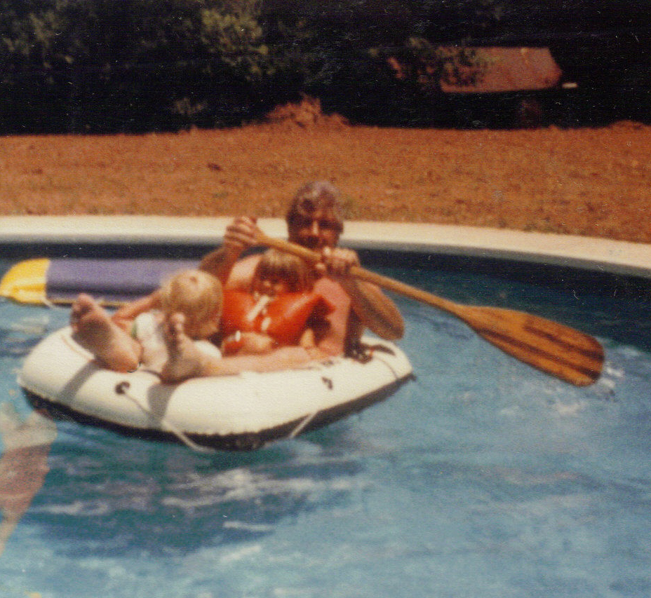 Dad Marie and Matt boating in the pool